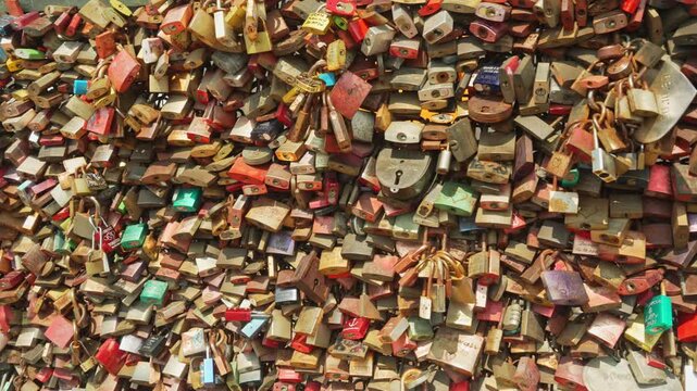 The bridge railings are densely hung with love locks. Millions of love locks hang on the Hohenzollern Bridge symbolize love