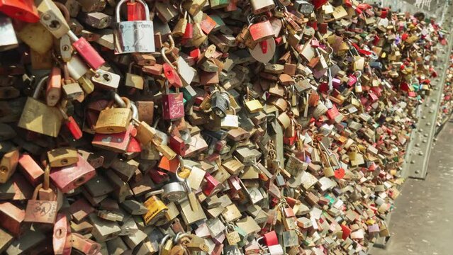 The bridge railings are densely hung with love locks. Millions of love locks hang on the Hohenzollern Bridge symbolize love