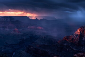 Fototapeta premium Stormy blue hour landscape of majestic Grand Canyon with dramatic clouds and rays of light