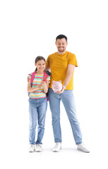 Father and his daughter breaking piggy bank with hammer on white background. Tuition fees concept