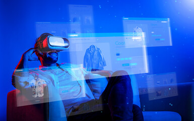 Caucasian man choosing and selecting product for shopping list while wearing visual reality goggles. Skilled person sitting at sofa with shopping bags while using VR glasses. Technology. Deviation.