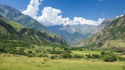 Obraz premium A sweeping view of a majestic mountain range with a small village nestled in the valley capturing the vastness of natural landscapes