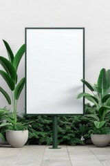 Vertical blank billboard surrounded by green plants, perfect for advertisement mockups and promotional content.