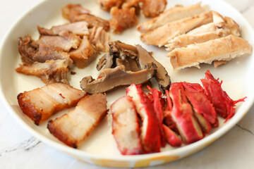 Close up image of Nasi campur babi. Chinese indonesian food.