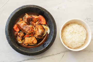 iga babi bakar with white rice. non halal food. indonesian chinese food.