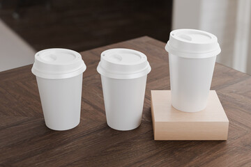 Multiple white take away coffee cup for mockup presentation branding design rendering minimalist blank close up with moody lighting calm and cozy engaging product display or disposable cup concept