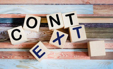 CONTEXT The word is written on wooden cubes and vintage background.
