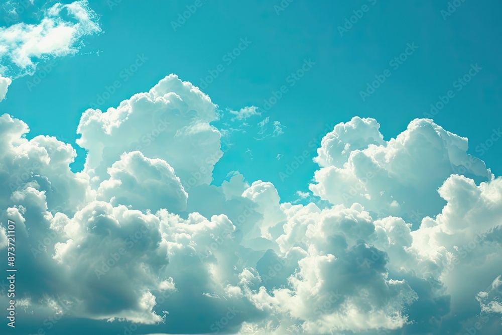Poster a sky with clouds and a plane, fluffy clouds floating across a blue sky, resembling cotton candy and
