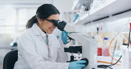 Laboratory, research and woman with microscope, science and check experiment with breakthrough....