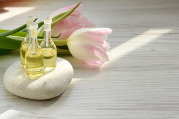 Spa concept. White spa stone and aroma oils with space for text. Meditation and minimalism. copyspase flatlay