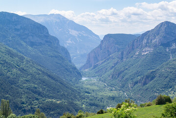 Fototapeta premium Aerial view of a Chistau valley between mountains, located in Spanish Pyrenees.