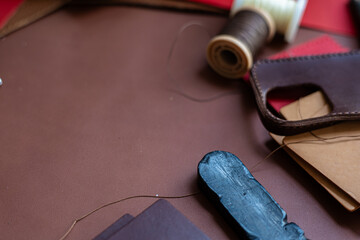 Background of genuine leather wallet craftmanship working with tool