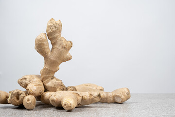 Fresh ginger root on white background, space for text
