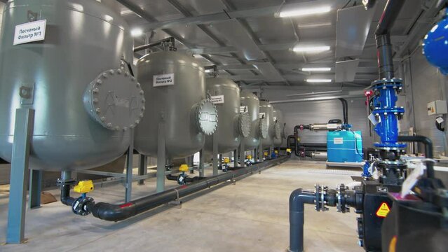 Sand filters to remove large contaminants from water. Sand tanks standing in water treatment plant allow tonnes of dirty water to pass through