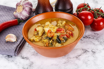 Traditional yellow Thai curry with chicken