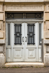 old wooden double door in building