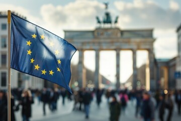European Union Flag Waving in Front of Iconic Brandenburg Gate - Symbol of Unity and Freedom