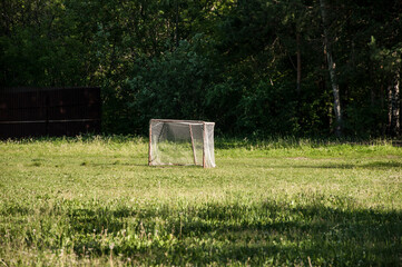 Old domestic small football goal with grid.