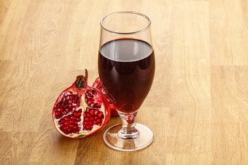 Sweet pomegranate juice in glass