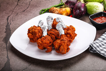 Indian cuisine glazed chicken lollipop