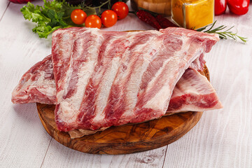 Raw pork ribs over board