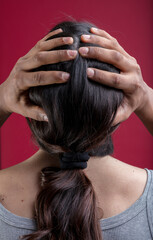 Naklejka premium Hands hold head, representing inclusivity and fluidity