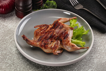 Grilled quail in the plate