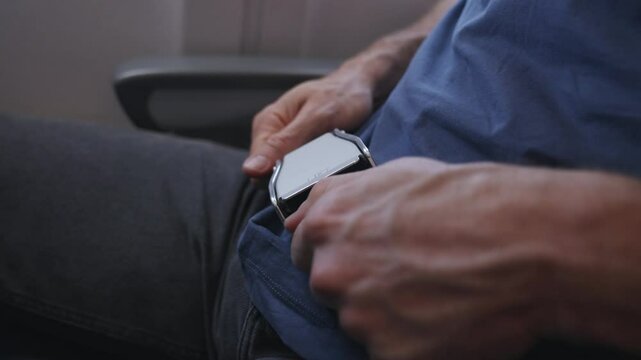 Fasten seatbelt on airplane. Secure and Buckle up your seatbelt on flight. Passengers seated inside airplane with safety belts fastened, awaiting takeoff. Ensuring safety while traveling is crucial.