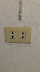 Old electric Power plug on wall