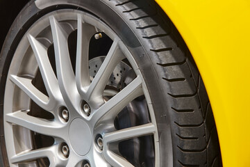 Obraz premium Car tyre detail. Vehicle part. Automobile maintenance industry