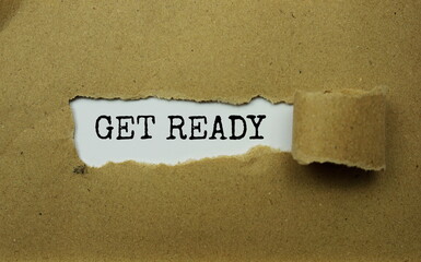 Get Ready message written on white paper with torn paper background