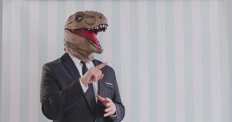Funny humorous speaker show or aggressive confident business man wearing cute dinosaur head mask, formal office suit, animal boss speaking in determined and forceful speech, offensive communication 