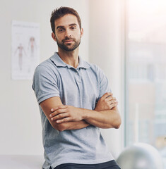 Portrait, man and physiotherapist with arms crossed in medical clinic for health, recovery or...