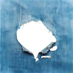 Large hole in worn blue denim fabric with frayed edges, cut out