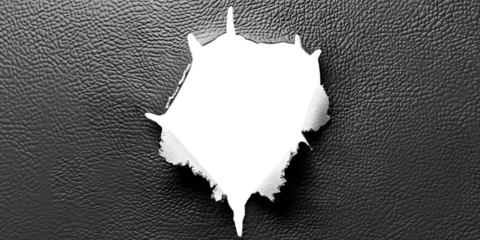 Hole in black leather with frayed edges, cut out