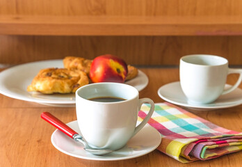 Traditional french breakfast with coffee and croissants