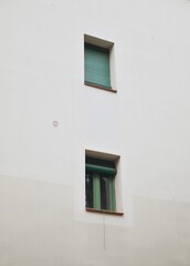 window with green blinds in spain 