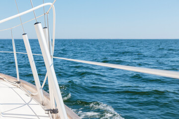 Obraz premium Turnbuckle aluminum covers on a classic sailboat on the side deck. Summer adventure, open sea with waves, recreation, cruise, vacations, regatta, sport in Finland, Gulf of Finland