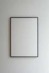 A blank photo frame with a 2:3 ratio hanging on the wall