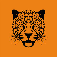 Black leopard head silhouette showing its feline beauty on orange background