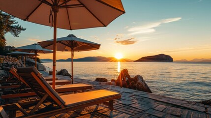 The coast of a resort beach with sun loungers and sun areas. The concept of summer vacation, travel.
