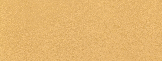 Texture of craft yellow paper background colors, macro. Structure of vintage kraft ocher cardboard.