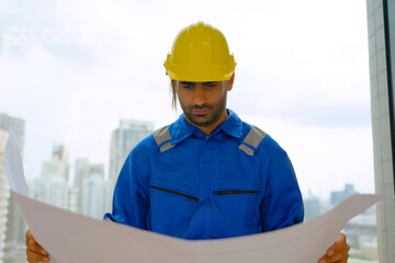 Engineer is working at tower.