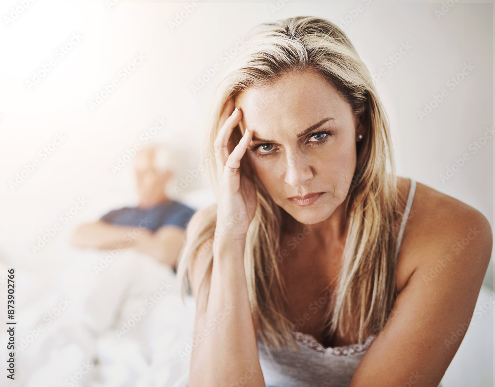 Poster Mature couple, woman and angry on bed in home with stress, frustrated and argument in marriage. Infidelity, person and portrait with conflict, relationship fail and ignore partner in bedroom of house