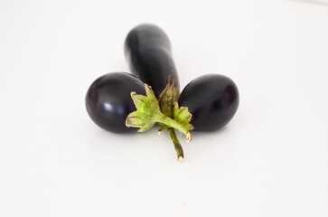 Fresh Eggplant,aubegine  with Beautiful Natural Colors on White Surface,natural colors of fresh eggplant displayed on a crisp white background