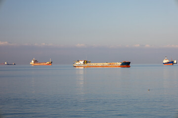 Serenity at Sea: Anchored Ships at Sunrise