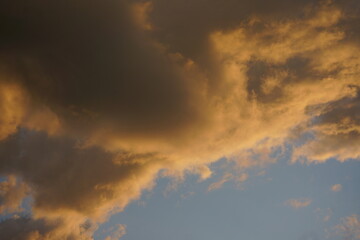 Clouds in golden sunset lighting