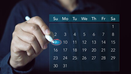 Businessperson or secretary manages time for effective work. Calendar on the virtual screen interface. Time management concept.