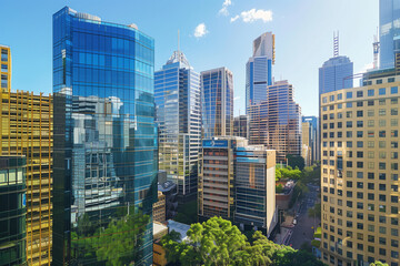 Drone View of City Office Buildings Beneath Blue Skies and White Clouds