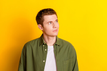 Obraz premium Photo of handsome nice man wear stylish khaki clothes novelty empty space isolated on vivid yellow color background